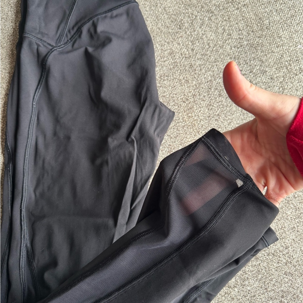 Lululemon invigorate tight. Black size 6. Mesh detailing at bottom